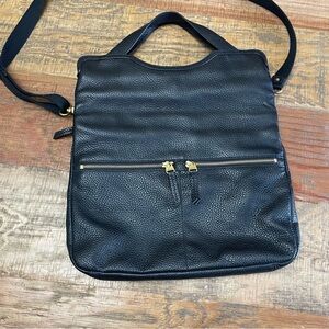 Fossil Erin fold over black pebbled leather crossbody with zipper details.